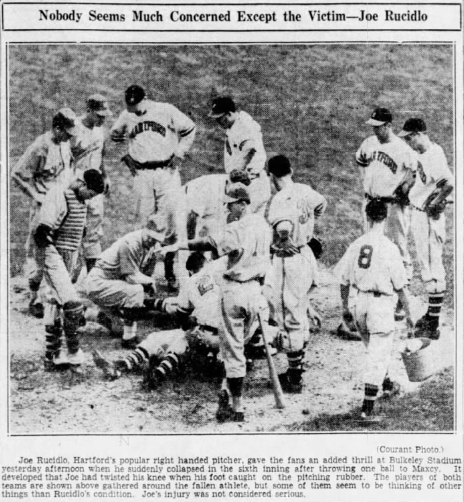 Joe Rucidio, Pitcher, Hartford Bees, injures knee at Bulkeley Stadium, 1940.